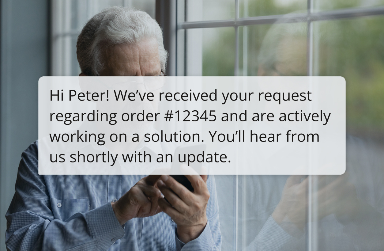 Man reading customer support text message